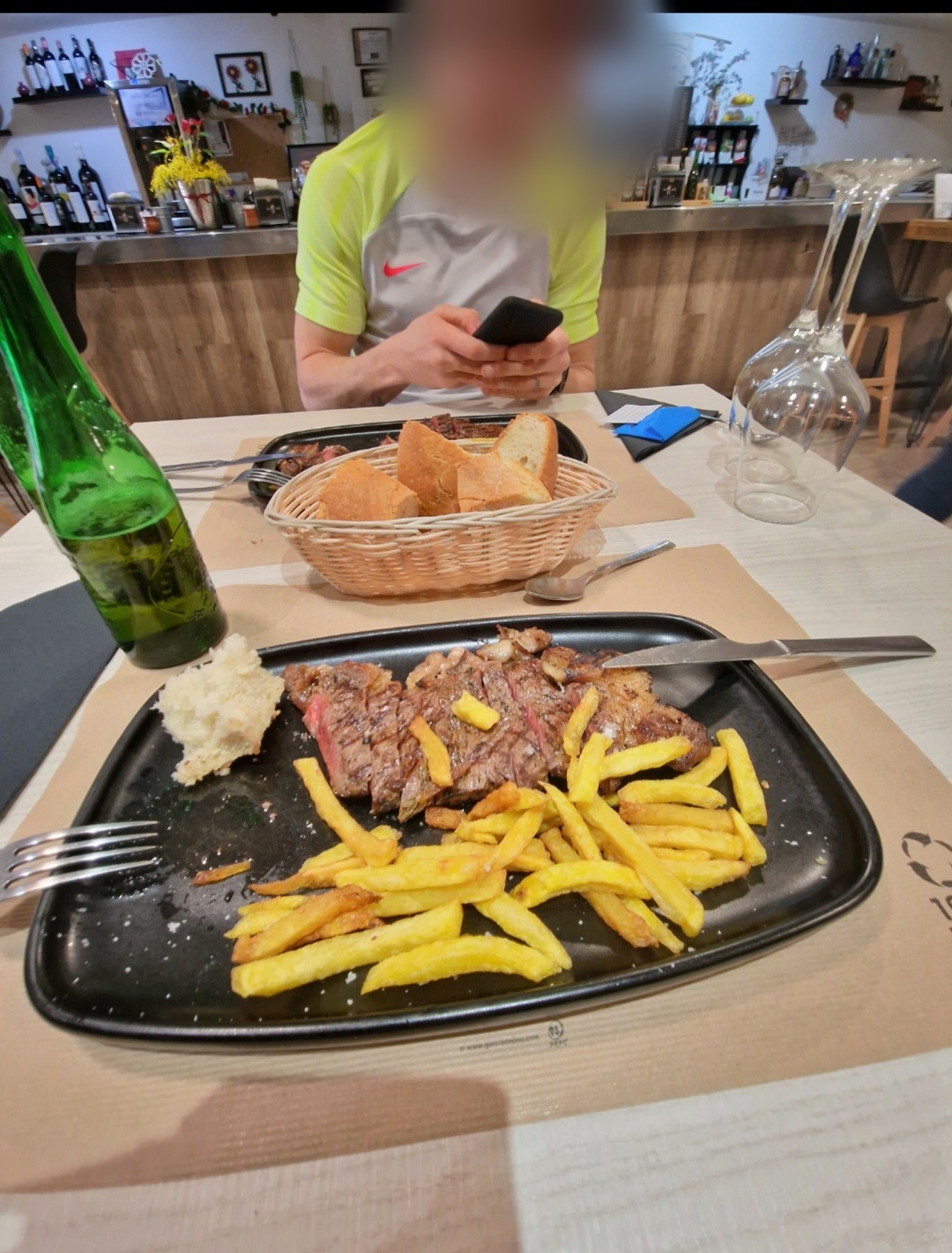 A meal at a restaurant after release from prison, face blurred for privacy