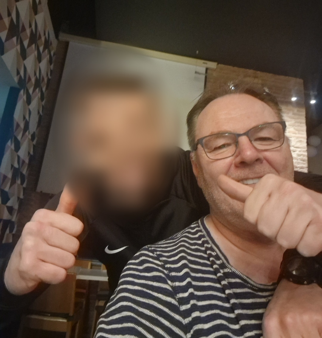GC Libertad founder with a former client after his release, client blurred for privacy
